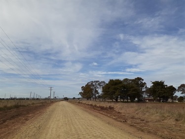 Northeys Road, Gravel overlay widening the former single lane carriageway.jpg